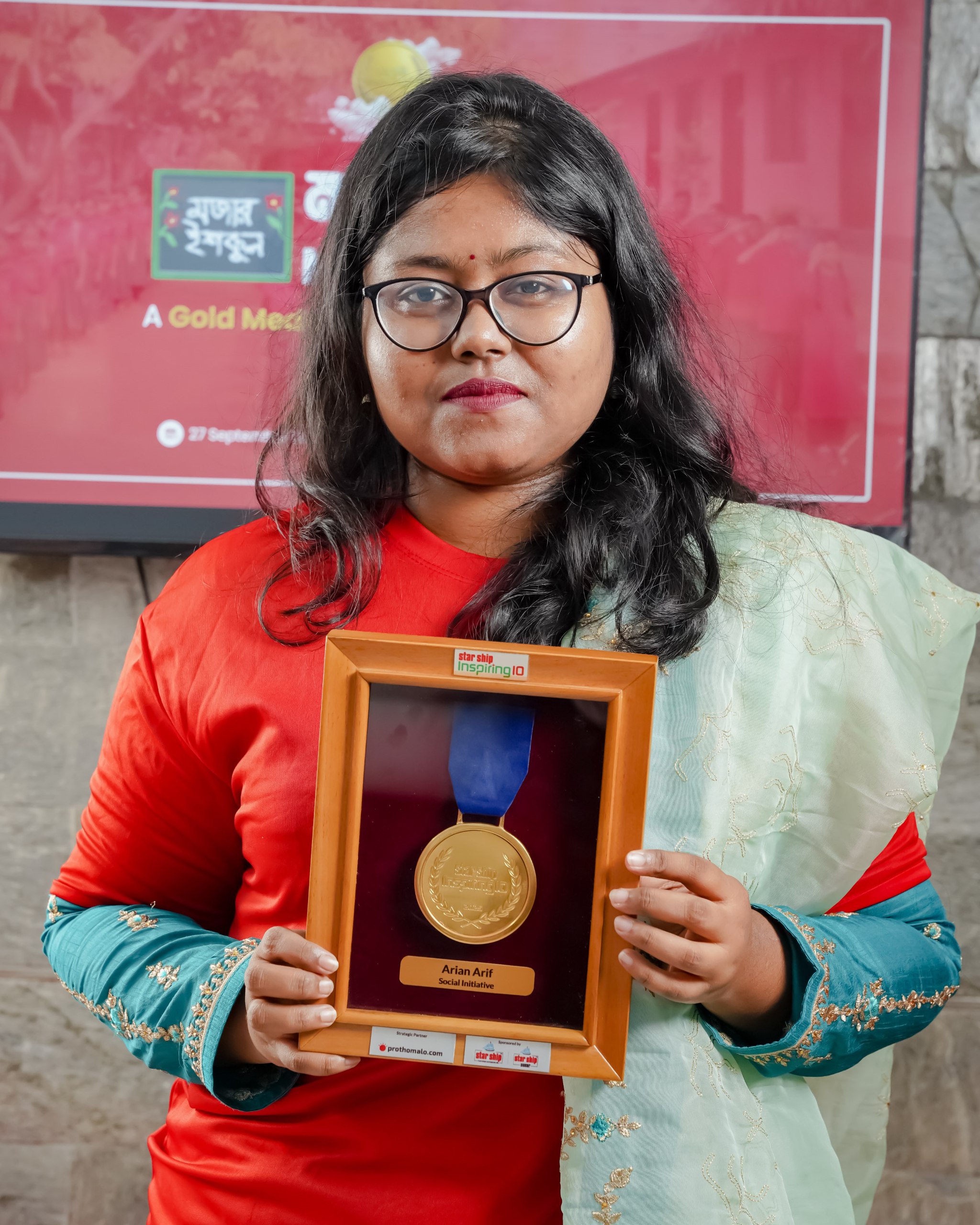 Abdul Halim holding Gold Medal — Mojar School