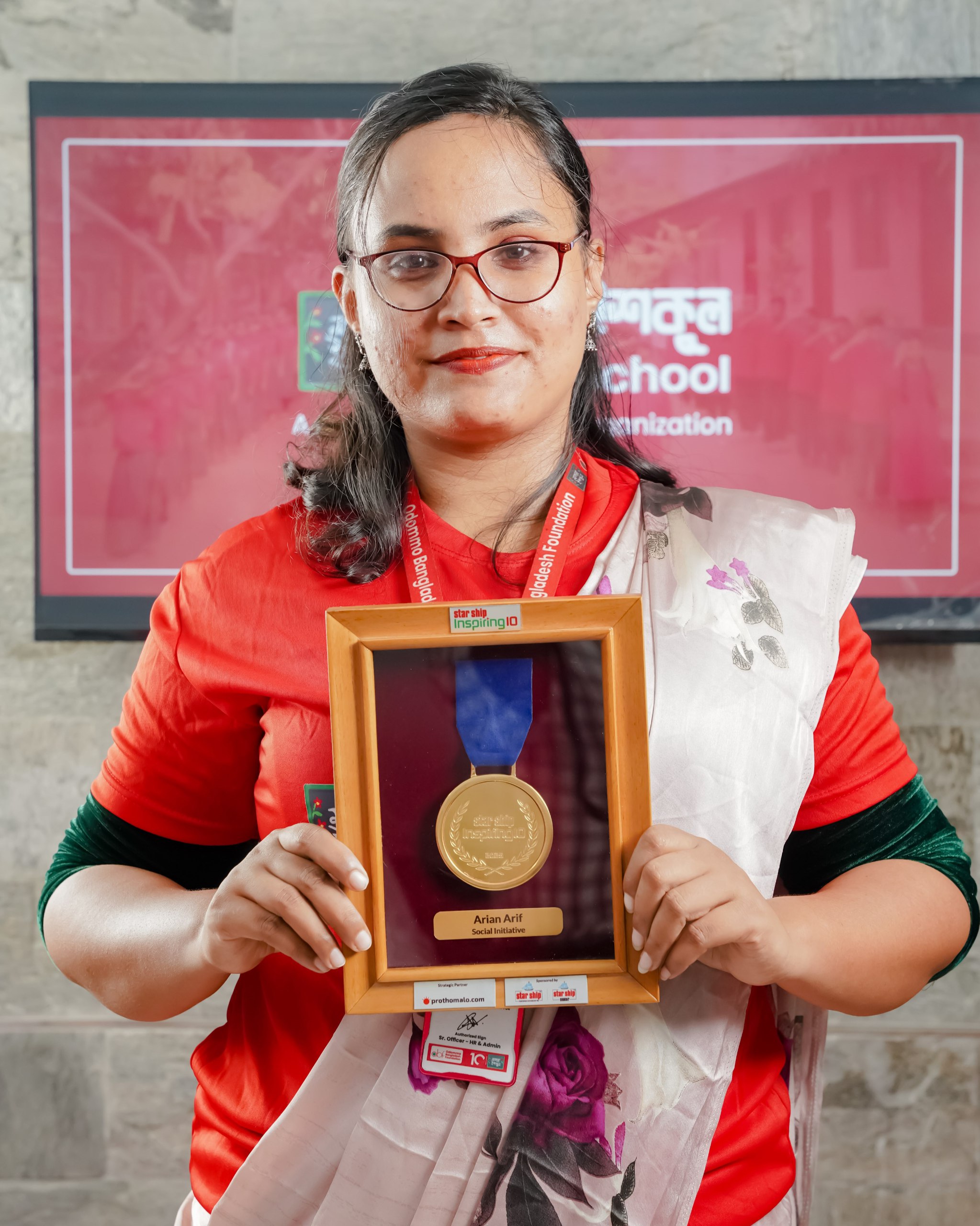 Abdul Halim holding Gold Medal — Mojar School