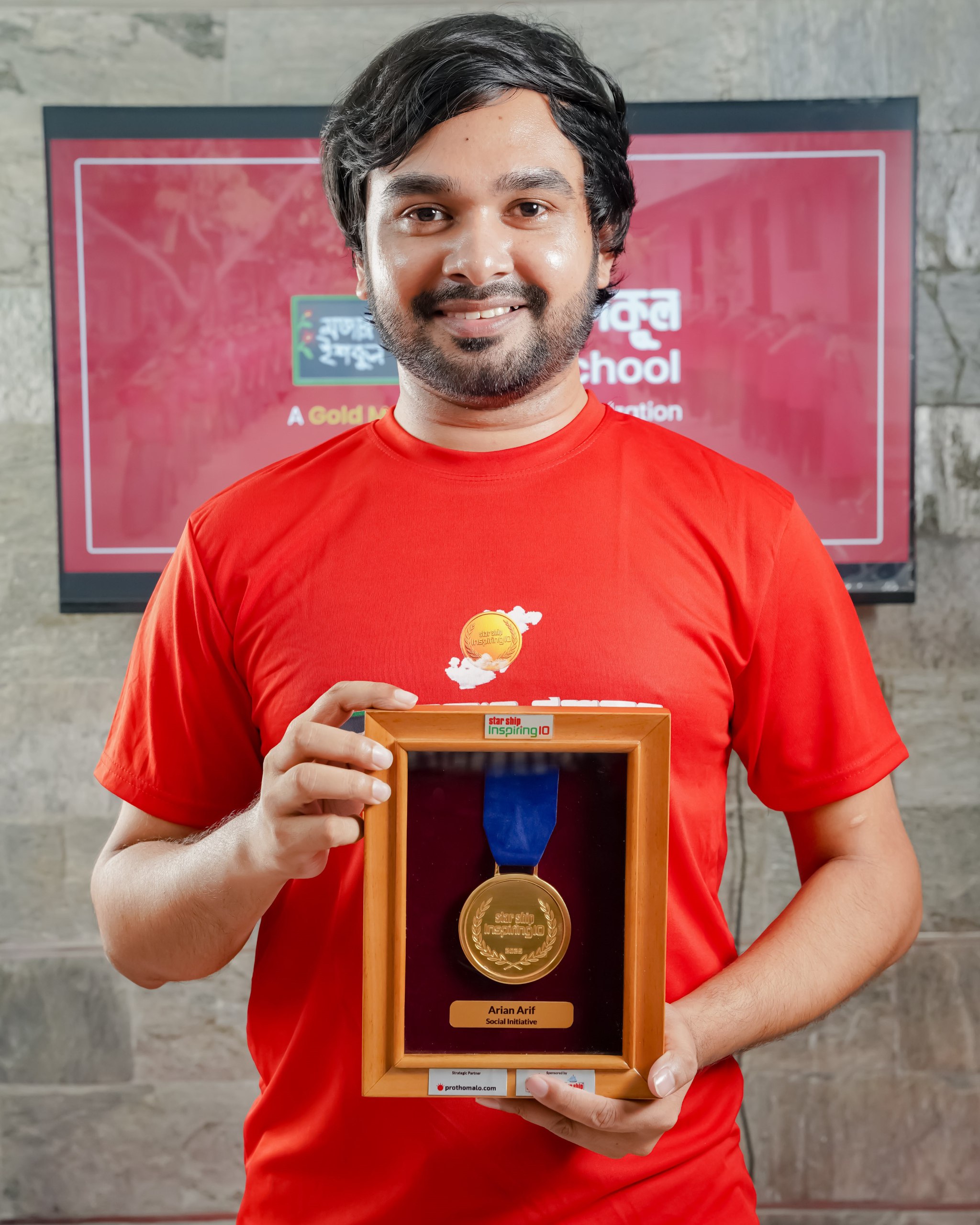 Abdul Halim holding Gold Medal — Mojar School