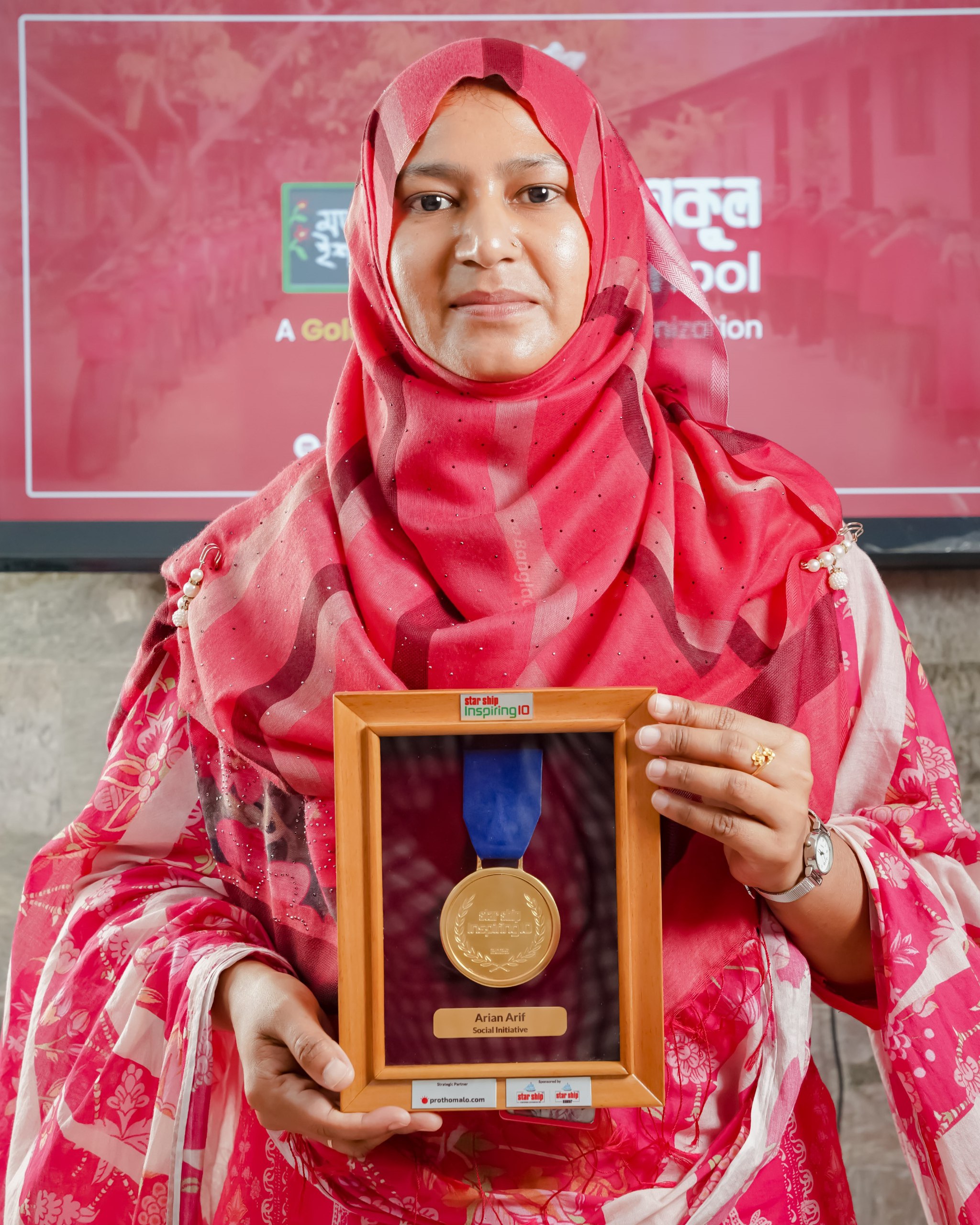 Abdul Halim holding Gold Medal — Mojar School